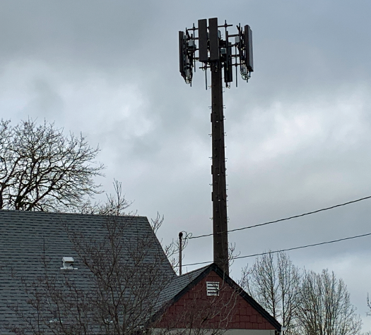 5G Cell Tower in backyard of a business with homes next door